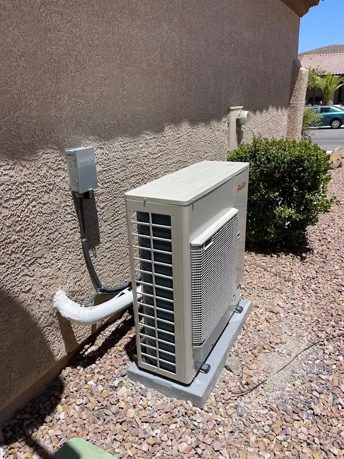 Residential air conditioning condenser unit in St. Michael